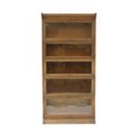 An oak five section modular bookcase by Gunn,