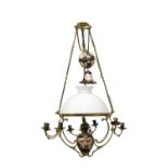 A large brass and porcelain mounted adjustable hanging oil lamp,