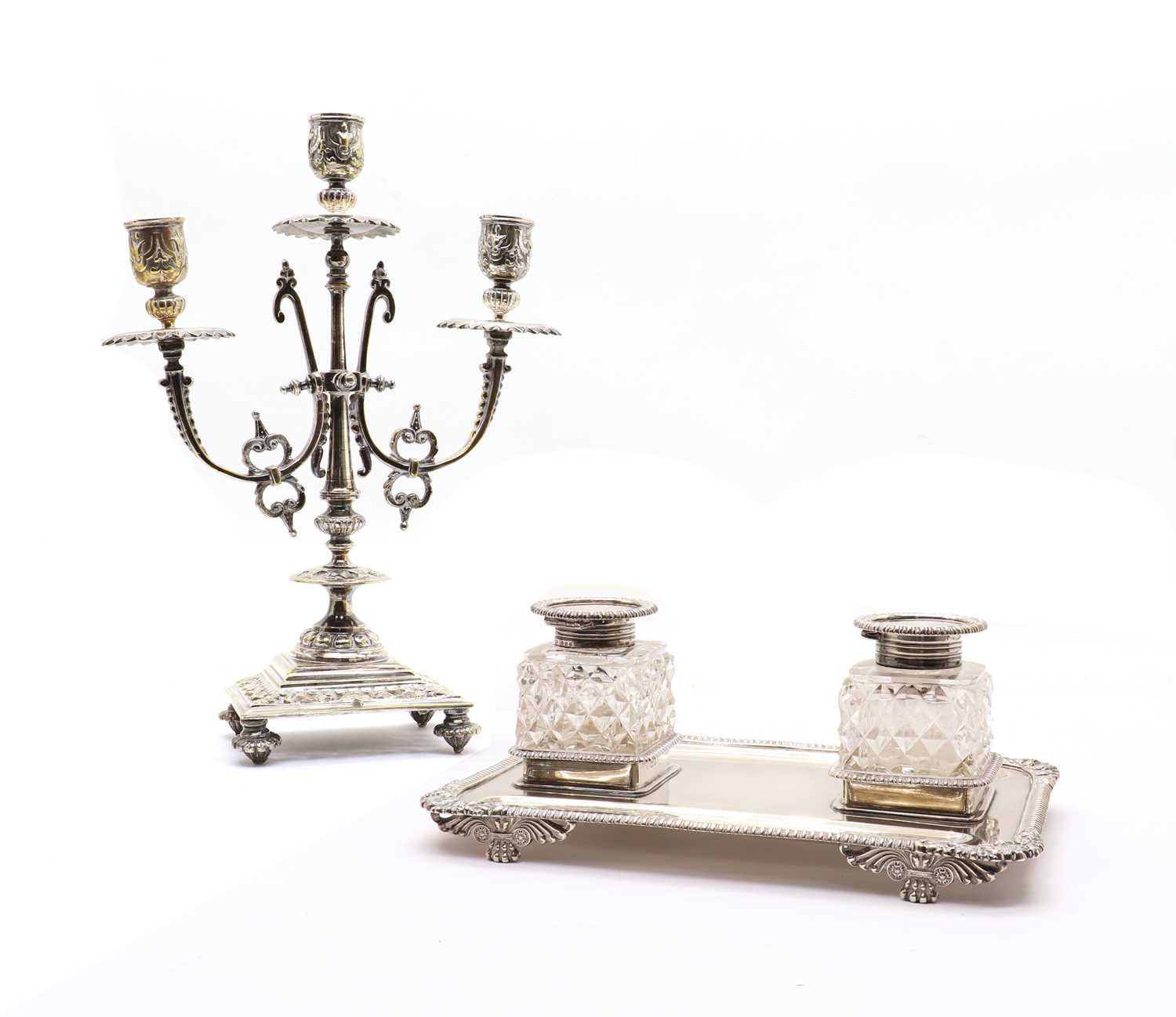 A silver ink stand with two cut glass ink wells,