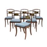 A set of six Regency mahogany and brass inlaid dining chairs,