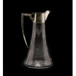 An Edwardian silver mounted and cut glass claret jug,