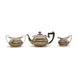 A composed three piece silver tea service,