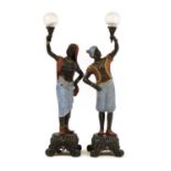 A pair of painted spelter Blackamoor standing lamps,