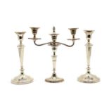 A pair of silver plated candlesticks,