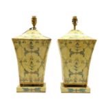 A pair of painted toleware table lamps,