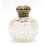 A William Commyns silver topped cut glass perfume bottle,