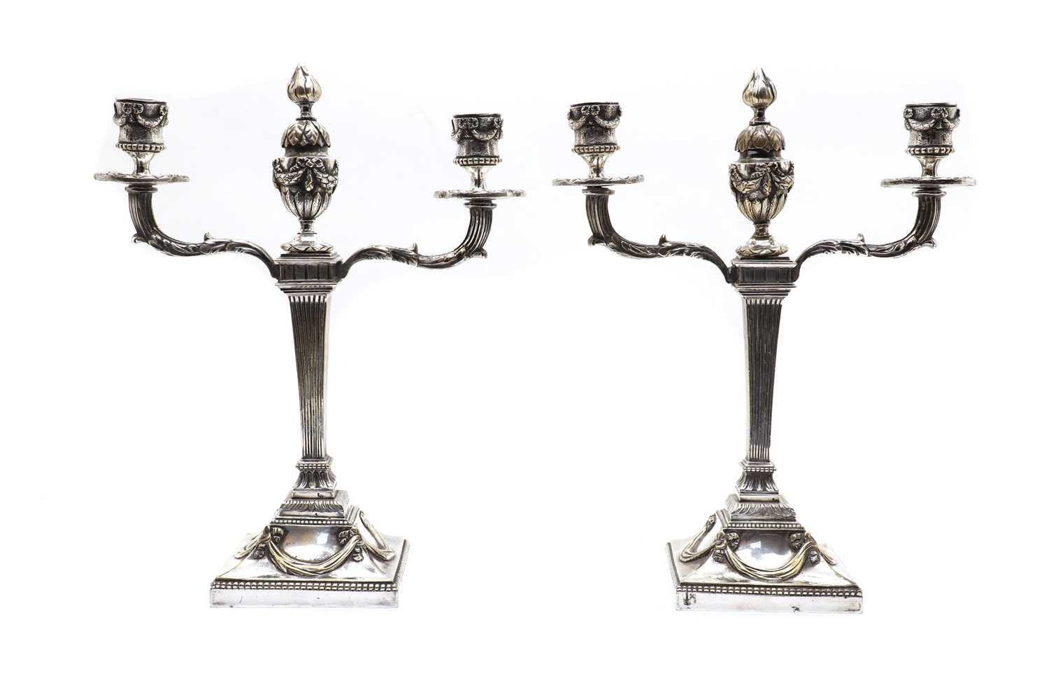 A pair of silvered bronze candelabra,