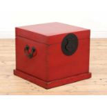 A Chinese-style red-lacquered box or occasional table