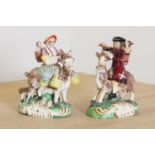 A pair of Staffordshire pottery figures,