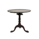 A George III style mahogany tripod table,