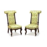 A pair of Victorian walnut prieu dieu,