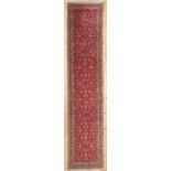 A Persian wool runner,