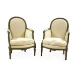 A pair of French Louis XVI style painted bergeres,