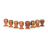 A COLLECTION OF EIGHT CARVED BOXWOOD MARIONETTE HEADS,