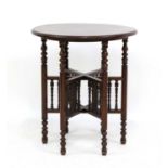 A Moorish-style mahogany occasional table,