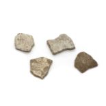 A group of four of Saltasaurus fossil eggshell fragments,