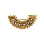 A Victorian gold pearl set crescent brooch,