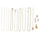 A collection of gold pendants and chains,