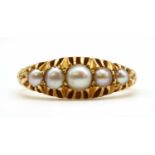 An Edwardian 18ct gold five stone split pearl ring,