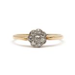 A gold diamond daisy cluster ring,