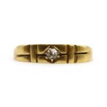 A gold single stone diamond ring,