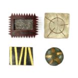 A collection of contemporary brooches,