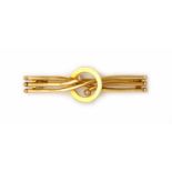 A gold bar brooch,