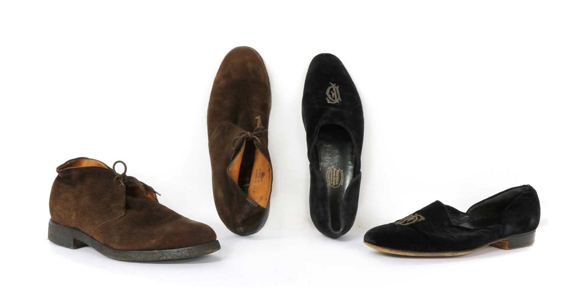 A pair of black suede shoes,