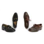 A pair of brown leather brogues,