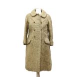 A cream astrakhan full-length coat,