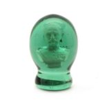 A Victorian green glass dump weight,