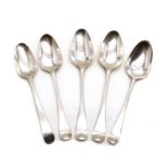 A collection of four George III and later silver shell back pattern spoons,