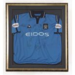 A framed Manchester City Football Shirt,