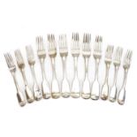 A collection of seven Victorian Fiddle pattern silver dessert forks,