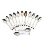 A collection of seven George III and IV Fiddle pattern silver serving spoons,