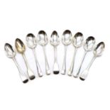 A group of four George III Fiddle pattern silver dessert spoons,