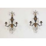 A pair of metal and gilt-heightened candle sconces,