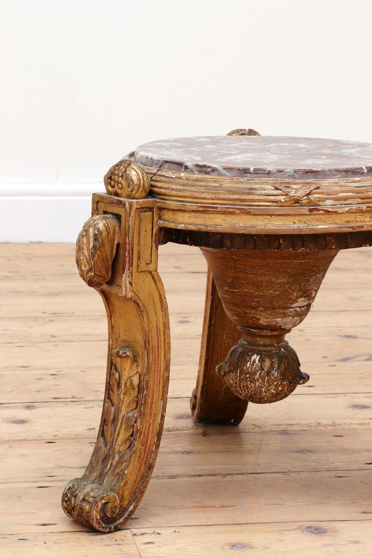 A giltwood urn stand,