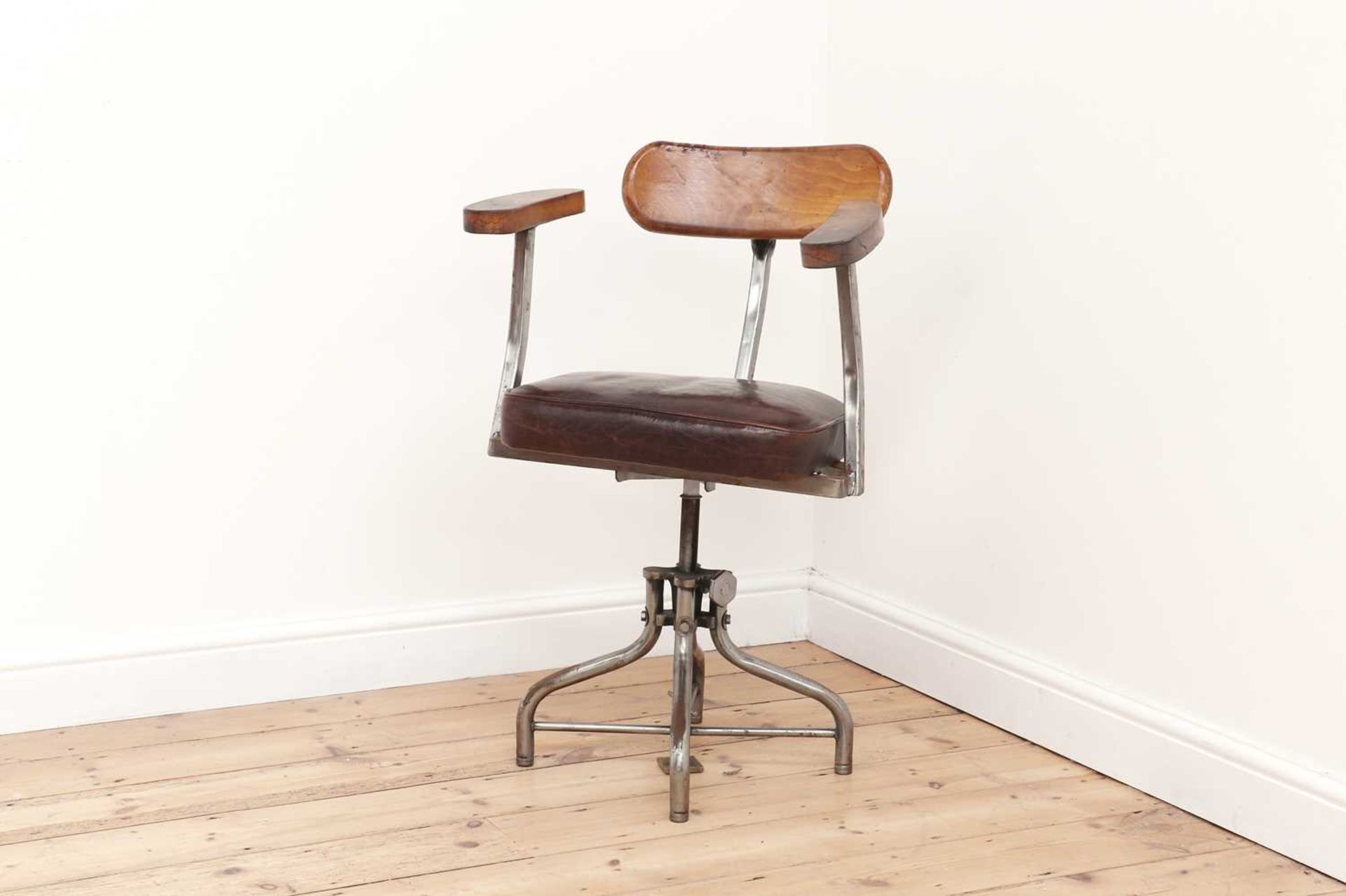 An industrial steel and leather desk chair,