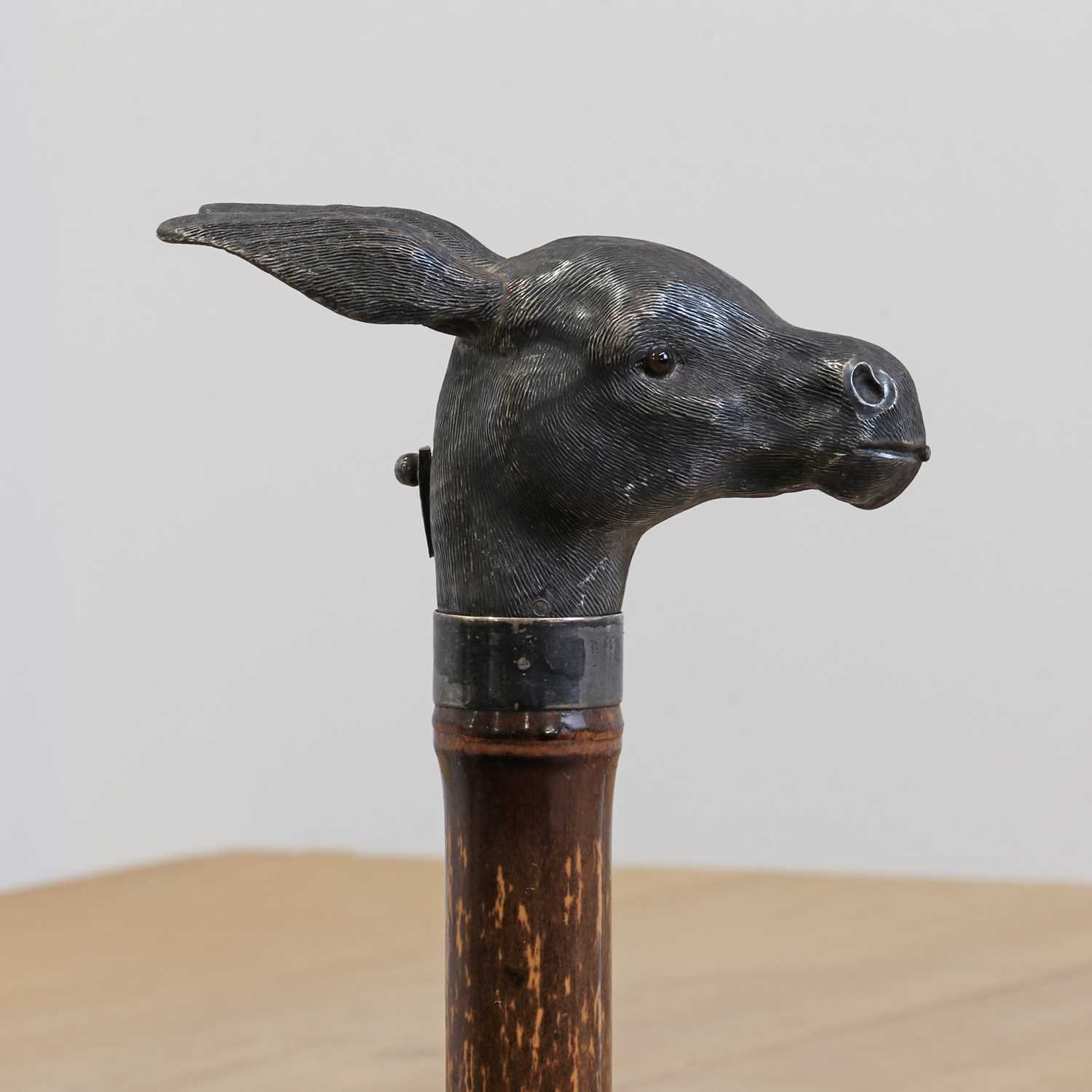 A silver 'spitting' donkey's head automaton walking stick, - Image 4 of 6