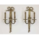 A pair of gilt-bronze twin-branch wall lights,