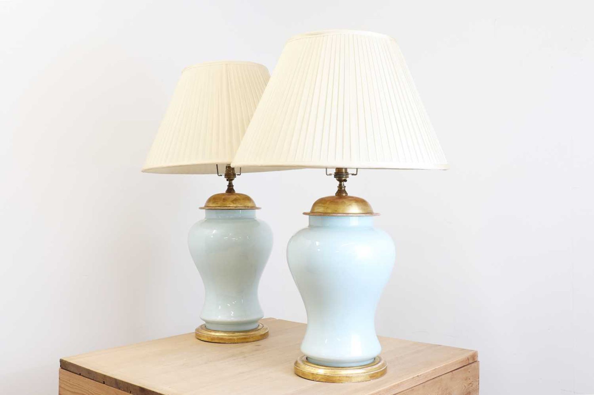 A pair of Chinese-style powder-blue glass table lamps,