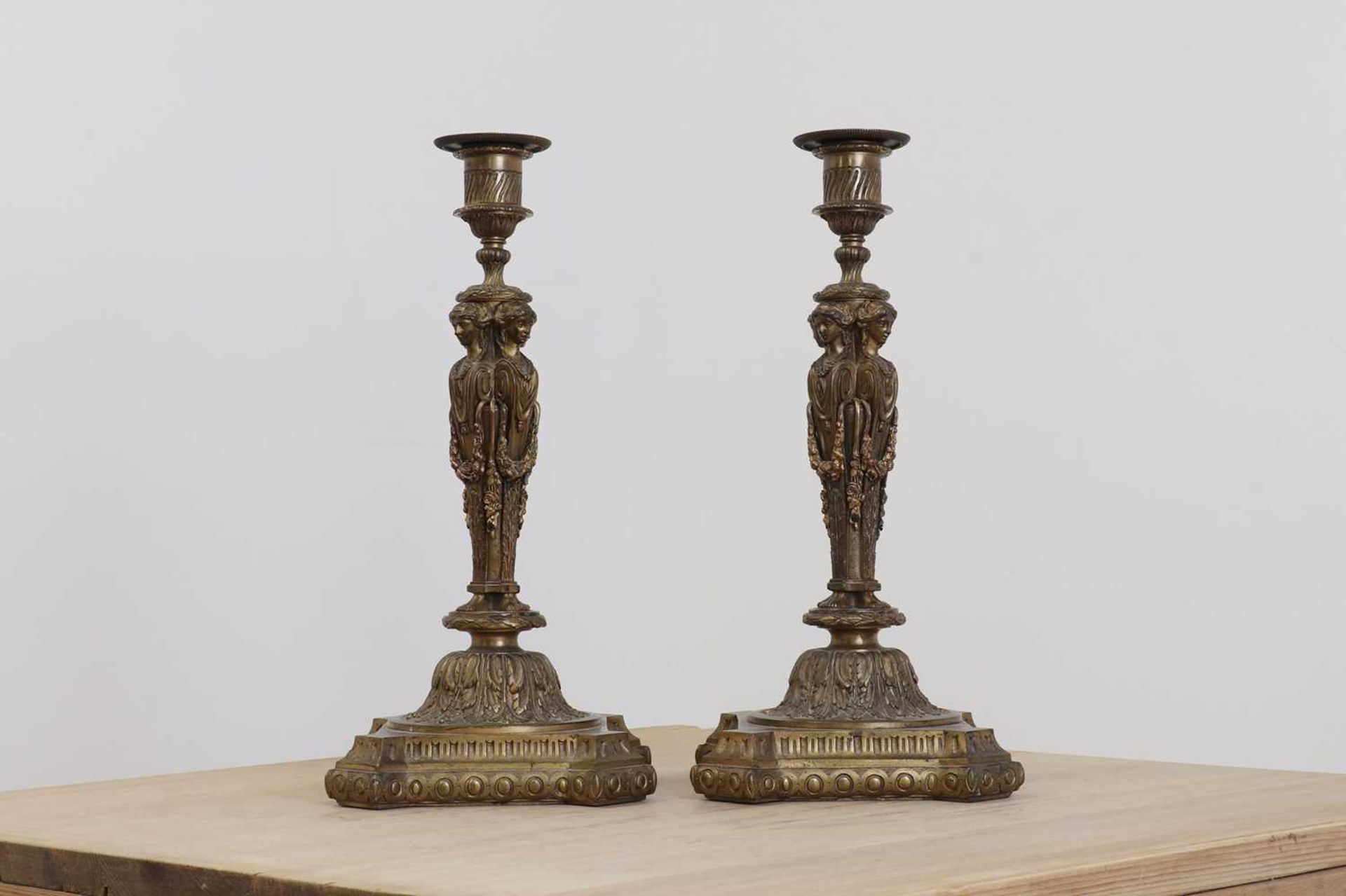 A pair of cast gilt-bronze candlesticks,
