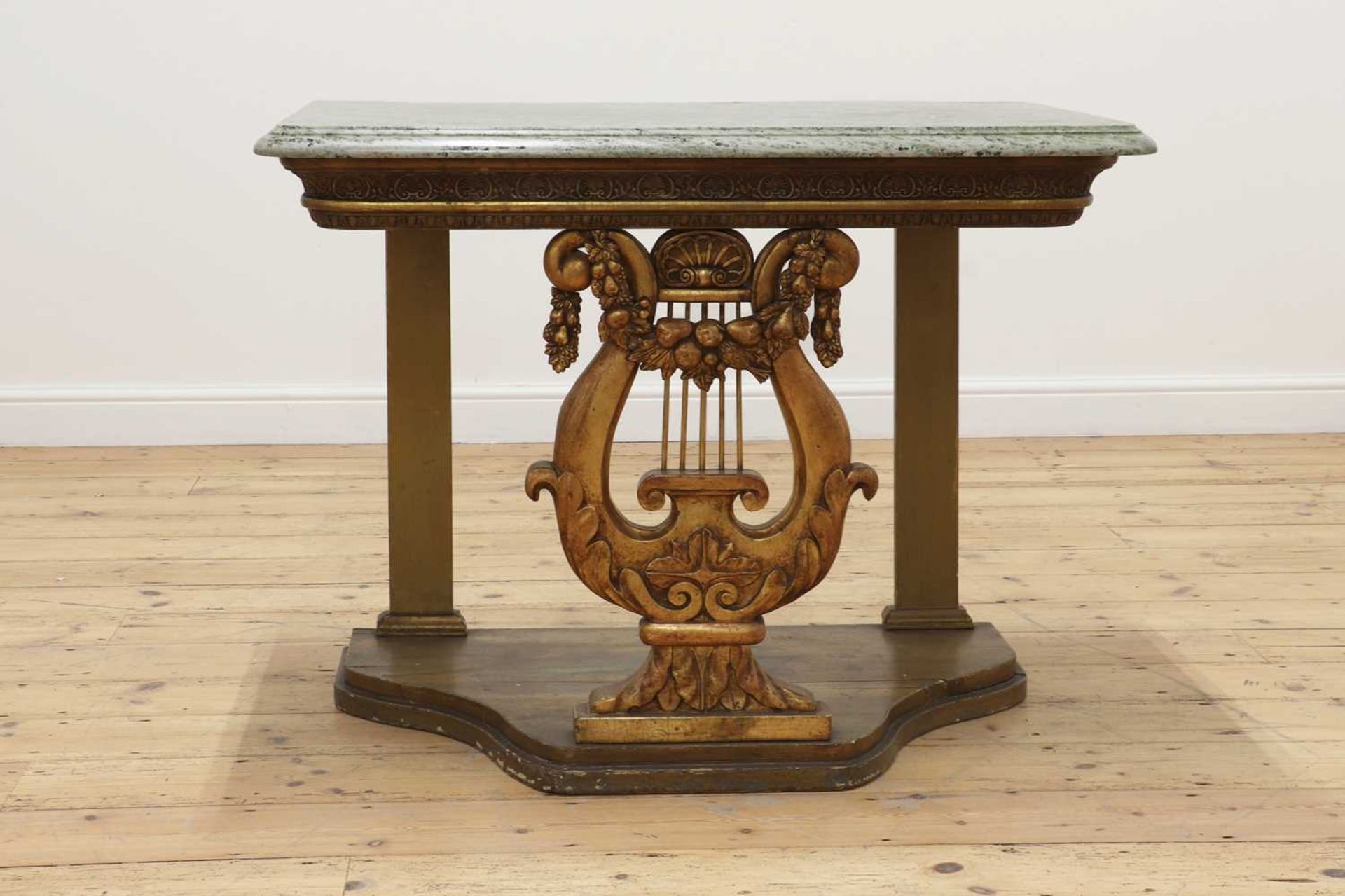 A gilt and painted console table,