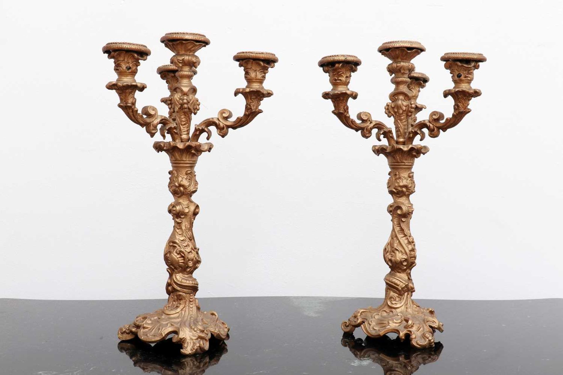 A pair of bronze candelabra,