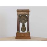 A rosewood and brass inlaid portico clock,