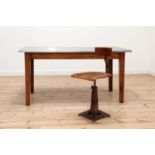 An industrial oak and stainless steel-topped table,