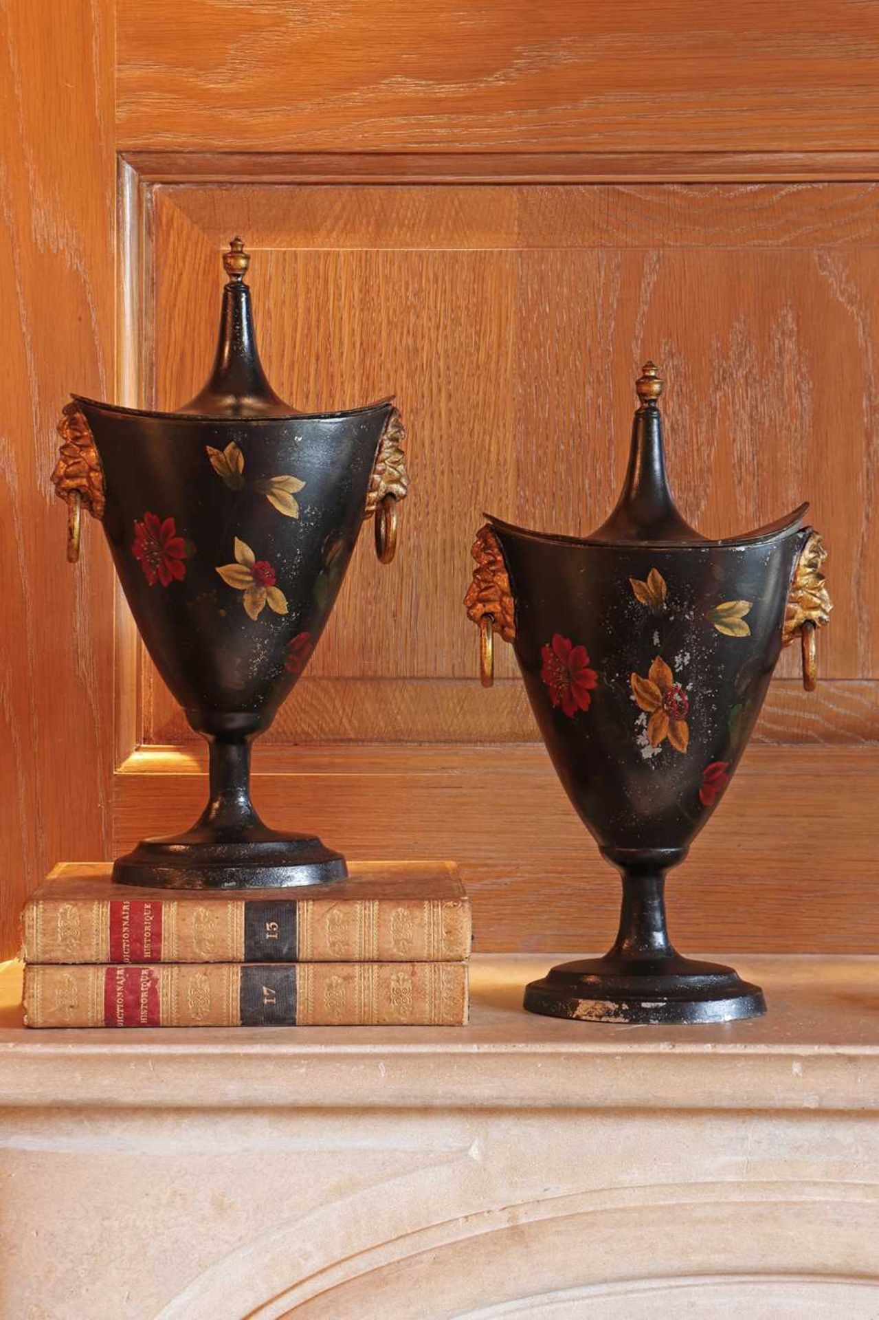 A pair of painted spelter chestnut vases and covers,