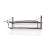 A polished steel luggage rack,