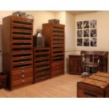 An oak and glazed haberdasher's cabinet,